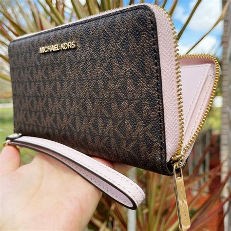 michael kors wristlet wallet mk logo|Michael Kors wristlet sale.